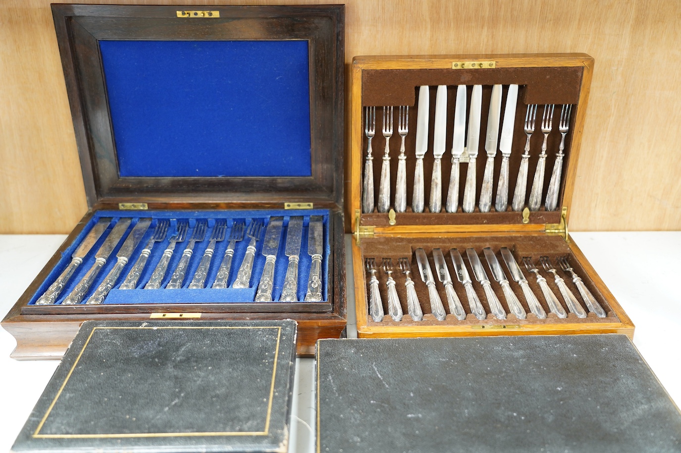A cased set of six silver handled tea knives and six other cased plated sets. Condition - fair